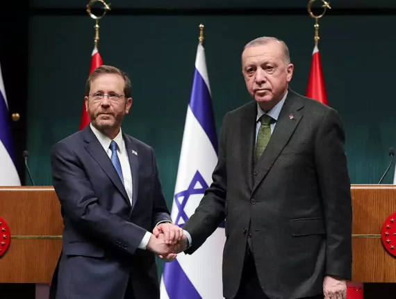 Turkish President Tayyip Erdogan and President Isaac Herzog shake hands during a joint news conference in Ankara, Turkey March 9, 2022 (Reuters/Presidential Press Office/Handout)